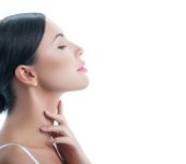 Woman Feeling Her Neck After Kybella Injections Beverly Hills CA