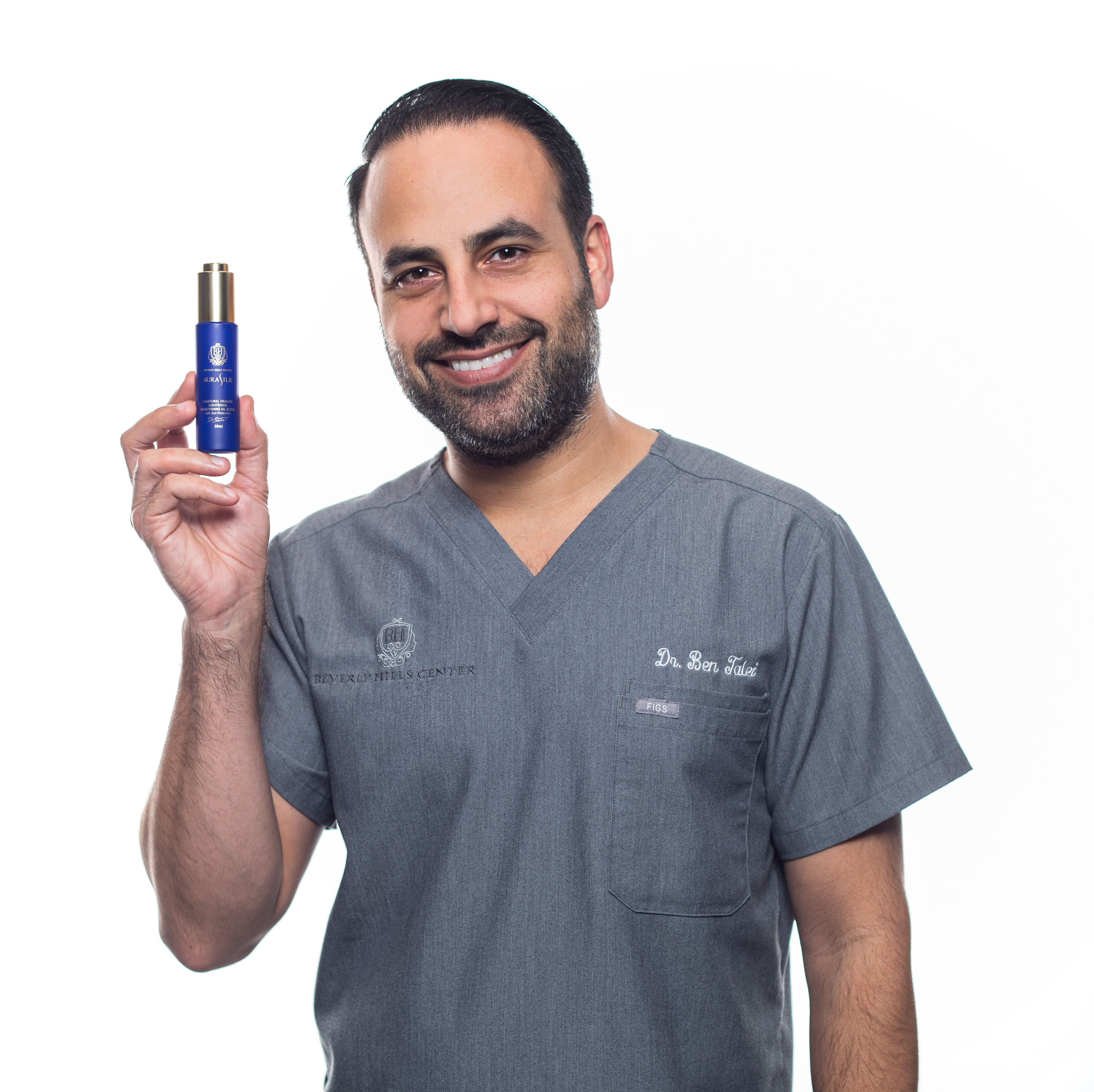 Dr. Ben Talei with Bottle of AuraSilk Face Oil