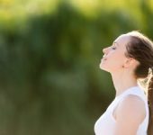 Young woman in a park relaxing in the sun