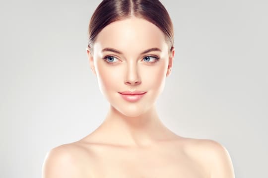 A beautiful youthful woman after face and neck cosmetic procedures in Beverly Hills, CA.