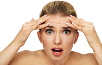 A woman concerned about her forehead considering Forehead Cosmetic Procedures in Beverly Hills, CA.