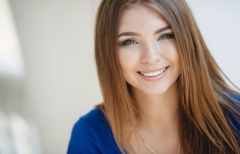 Happily smiling beautiful teenage girl.