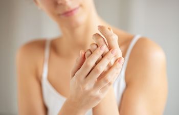 Woman watching her hands.