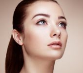 young attractive woman with big blue eyes looks up