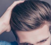 close up on thick and healthy hair man