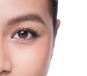 Eyes. Closeup of beautiful asian woman with brown eyes make up eye shadow