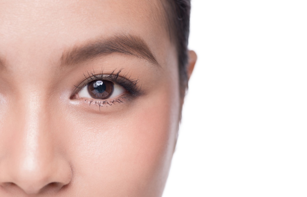 Eyes. Closeup of beautiful asian woman with brown eyes make up eye shadow